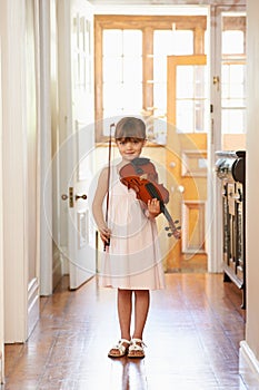 Violin, girl and portrait of child in home for learning, practice or music education. Art, fiddle and student with bow