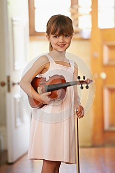 Violin, girl and portrait of happy kid in home for learning, practice and music education. Art, fiddle and student with