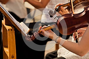 Violin in the hands of musicians