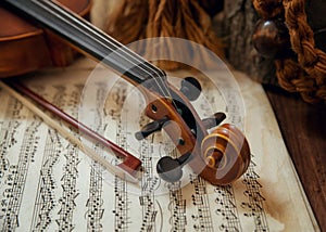 Violin head and bow on sheet music