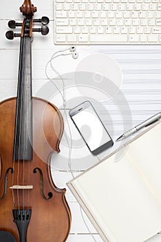 violin with keyboard computer music paper note dvd disc and smart phone