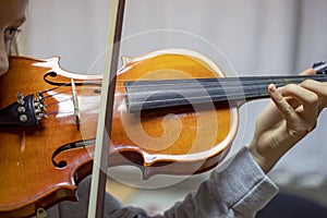 Violin lesson, correct hand position and bow, horizontal format