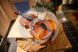 Violin lies on a small table