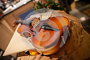 Violin lies on a small table