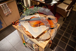 Violin lies on a small table