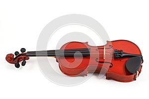 Violin lying down on white bac