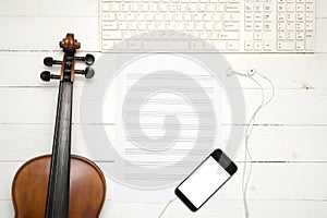 Violin with music paper note keyboard and smart phone