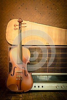 Violin and old radio in vintage style