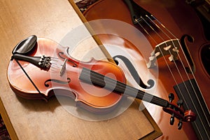 Violin on a piano bench