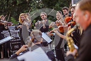 Violin players playing classic instrumental music on the street