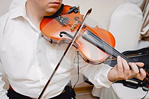 Violin playing viola musician playing . Man violinist classical musical instrument  fiddle