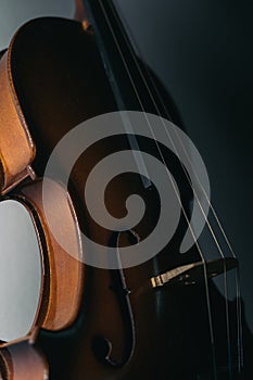 Violin from side with a gray background