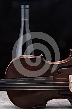 Violin with Wine Bottle on tile