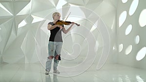 Violinist performs a musical composition on a violin in a white studio