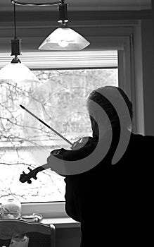 Violinist practicing at home