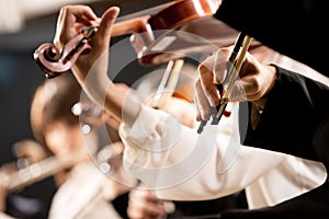 Violinists performing, hands close-up