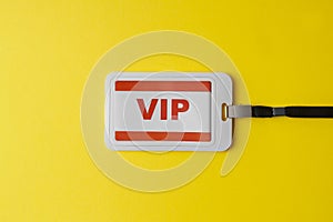 Vip badge on yellow background, top view