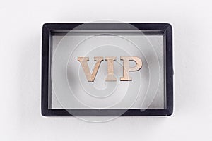 VIP is written in abstract letters in black frame. White background