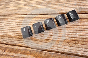VIRAL wrote with keyboard keys on wooden background