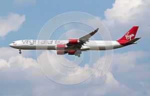 Virgin Atlantic Airbus A340-600 G-VRED passenger plane landing at London Heathrow Airport