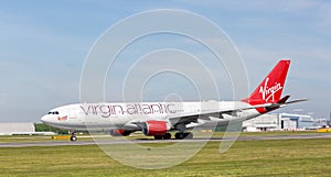 Virgin Atlantic A330-200 `Honkytonk Woman` starting to take off at Manchester Airport