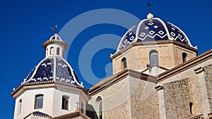 Virgin of the Consol church in Altea, Spain
 against a backdrop of the blue sky photo