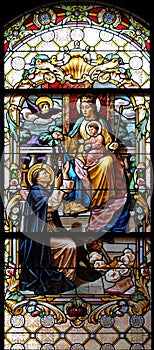 Virgin Mary with baby Jesus and Saint Dominic