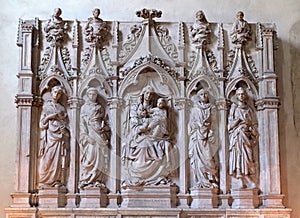 Virgin Mary with baby Jesus and Saints, Jacopo della Quercia\'s sculpted polyptych, Basilica of Saint Frediano, Lucca, Italy photo