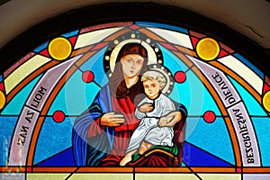 Virgin Mary with baby Jesus, stained glass window in the Shrine of the Our Lady Queen of Peace in Hrasno, Bosnia and Herzegovina