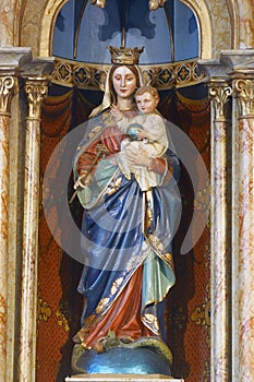 Virgin Mary with baby Jesus, statue on the high altar in the parish church of the Visitation in Garesnica, Croatia