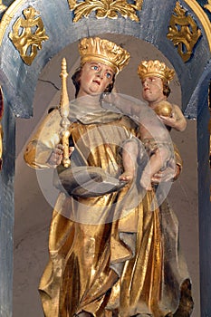 Virgin Mary with baby Jesus, statue on the altar in the Church of the Three Kings in Komin, Croatia