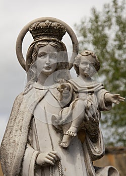 Virgin Mary and Child Jesus in a cemetery