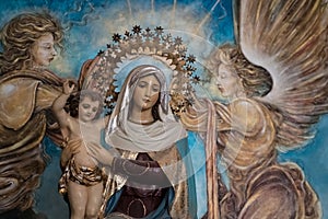 Virgin Mary with child Jesus and painted angels, beautiful statue Mary and son Jesus in Havana Cathedral, Cuba photo