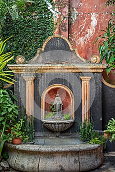 Virgin Mary fountain at shopping mall, La Antigua, Guatemala photo