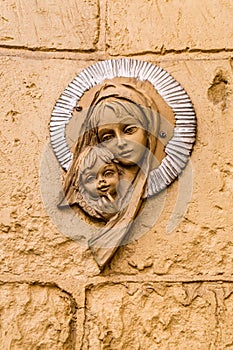 Virgin Mary icon. Religious icon on stone wall