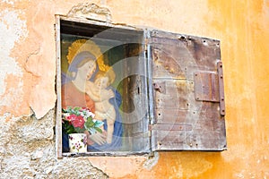 Virgin Mary with Jesus Christ in a niche in the wall