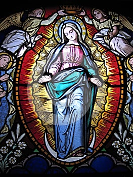 Virgin Mary Stained glass in church in Portugal photo