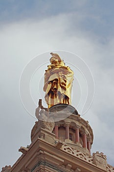 Virgin Mary statue with child on cathedral bell tower. Marseille, France