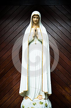 virgin mary statue. holy woman sculpture in roman catholic church. our lady image