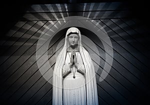 virgin mary statue. holy woman sculpture in roman catholic church. our lady image. black & white