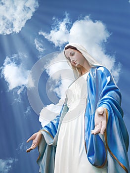 Virgin Mary statue with nice sky and light ray background,