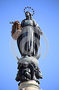 Virgin Mary on top at Piazza di Spagna in Rome, Italy photo