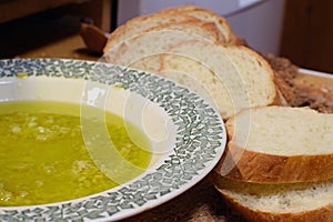 Virgin olive oil with mashed garlic cloves and baguette slices