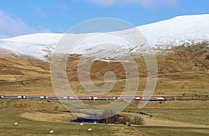 Pendolino electric train in winter countryside