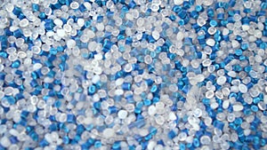 Virgin plastic pellets with blue pigment pellets