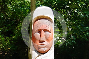 Virginia, U.S - July 1, 2020 - Close up of one of the Jamestown Settlement Totem poles at Powhatan Indian village