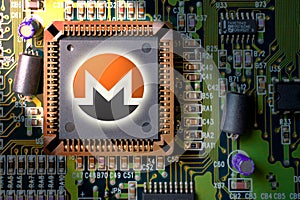 Cryptocurrency and blockchain - financial technology and internet money - circuit board mining and coin Monero XMR