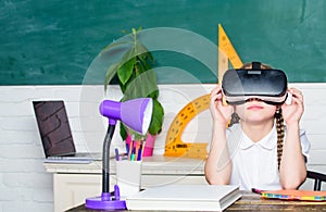 Virtual education. Child cute pupil wear hmd vr glasses. Studying in virtual reality. Modern technology. Interesting
