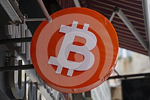 virtual money Bitcoin cryptocurrency- Bitcoins accepted here - logo of bitcoin on sign