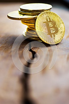 Virtual money Bitcoin cryptocurrency - halvings the Bitcoin currency - gold coin on the wooden background with a symbolical halvin